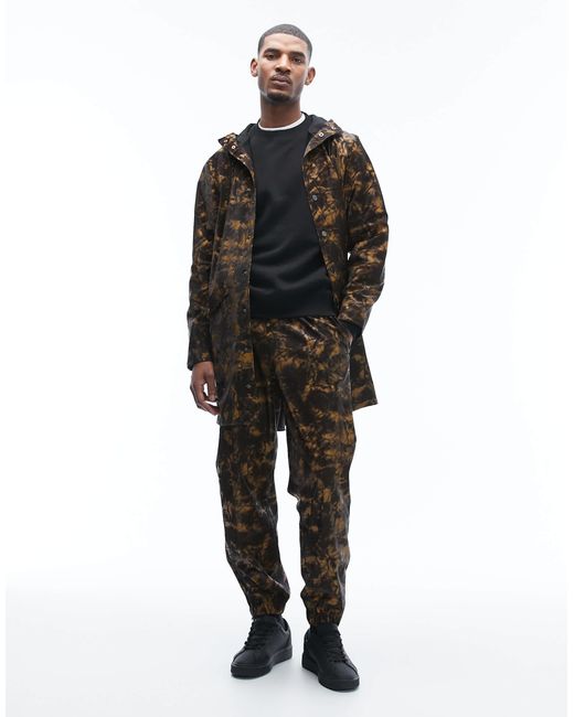 Rains – 12020 – wasserdichte unisex-longline-jacke mit kapuze und abstraktem, verschwommenem muster in Black für Herren