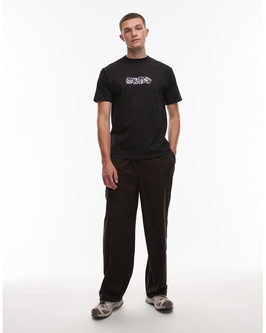 Camiseta Negra Con Estampado Gráfico Del Logo En El Centro No Dice De Vans de color Black