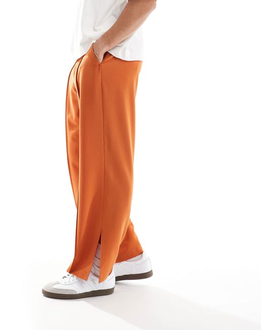 Pantalon large habille a pinces et fentes laterales rouille ASOS pour homme en coloris Orange Lyst