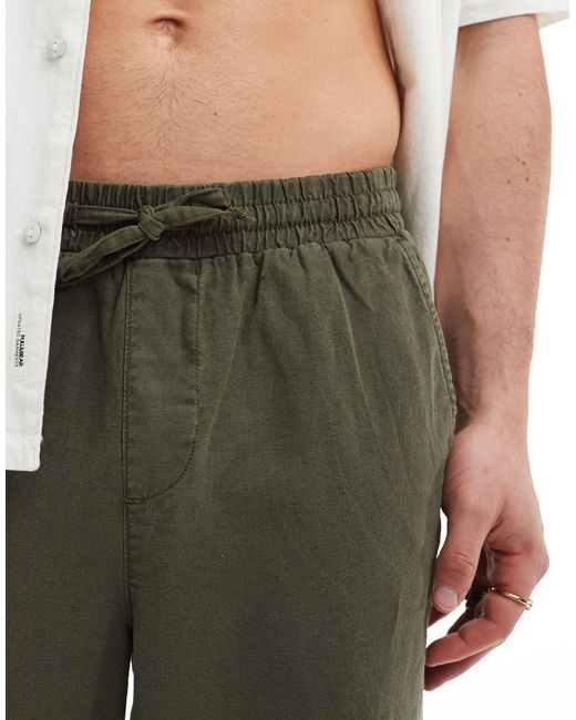 Pantalones s holgados con cinturilla elástica ASOS de hombre de color Green