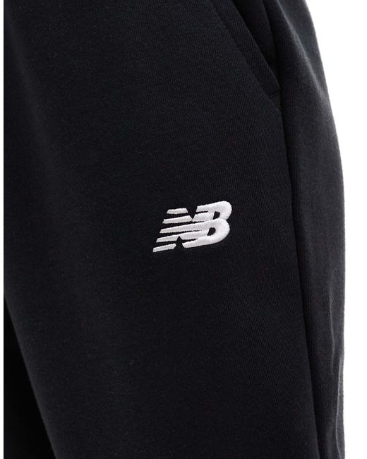 Sport essentials - pantalon New Balance en coloris Blue