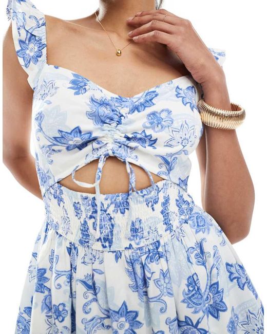 Mono Corto Azul Con Estampado Floral, Abertura Y Mangas Con Volante De Hollister de color Blue