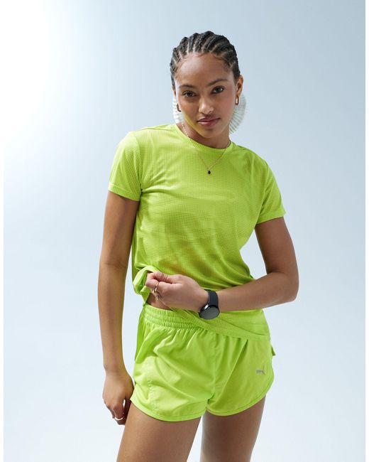 Camiseta amarillo lima run favourite PUMA de color Green