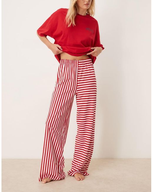 Pijama De Pantalones De Pernera Ancha Y Camiseta Extragrande Con Estampado "Après Ski" De Asos Design Tall ASOS de color Red
