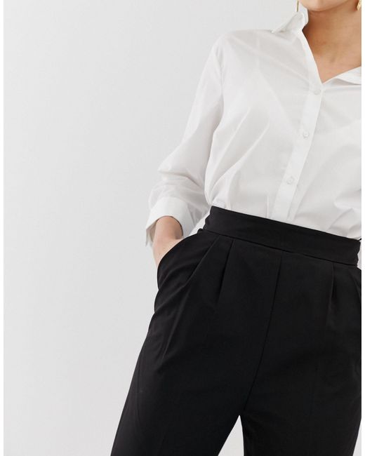 high waisted black tapered trousers