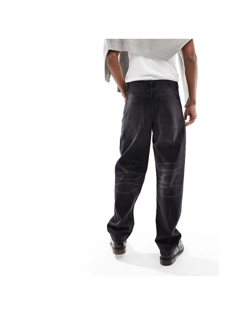 Jeans larghi slavato di ASOS in Black da Uomo