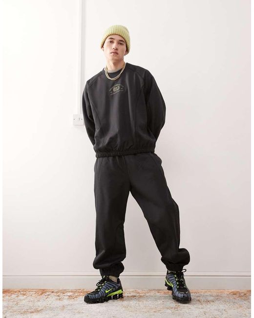 Weekday Black Co-ord Oversized joggers With Fantazy Fussball Graphic Print And Contrast Seams for men