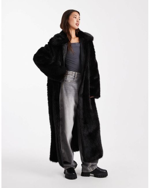 Manteau long en fausse fourrure avec liseré ASOS en coloris Black