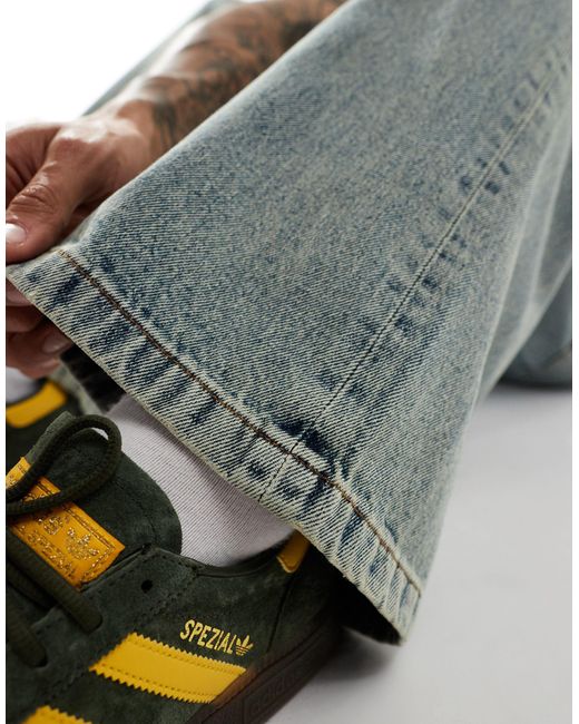 Jeans larghi con fondo ampio tinti di ASOS in Blue da Uomo