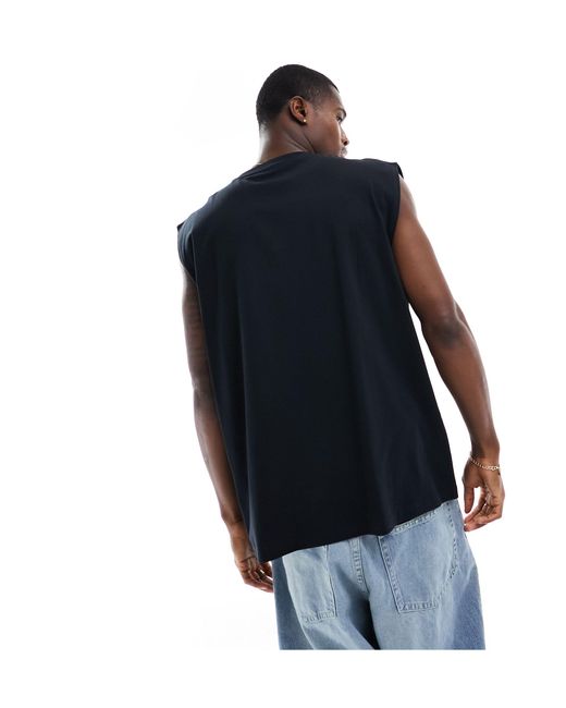 Camiseta negra extragrande sin mangas con estampado en el pecho ASOS de hombre de color Blue