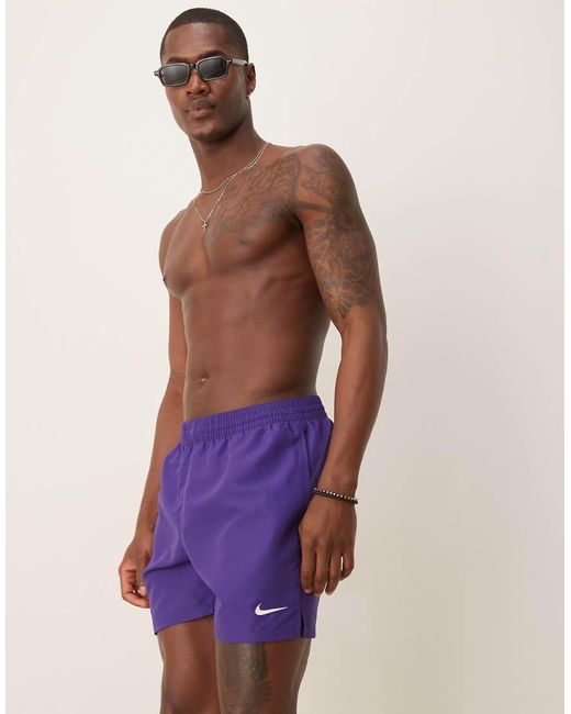 purple nike swim trunks
