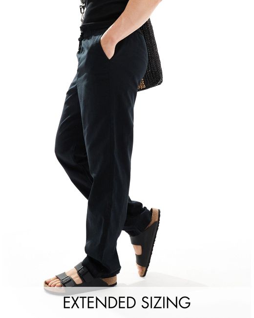 Pantalones s holgados con cintura elástica ASOS de hombre de color Black