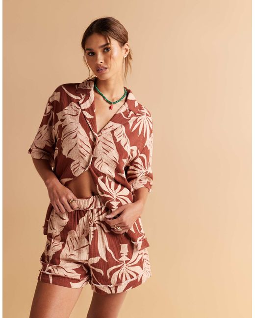 Short d'ensemble en étamine avec bords effilochés et imprimé palmiers ASOS en coloris Orange