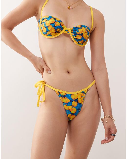 Reclaimed (vintage) Multicolor – seitlich gebundene bikinihose mit kontrasteinfassung und fruchtigem zitronenprint