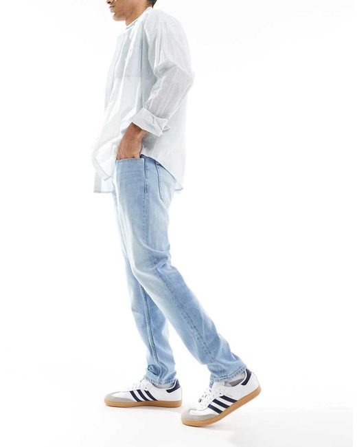 Vaqueros De Corte Tapered Slim Con Lavado Claro Austin De -Azul Tommy Hilfiger de hombre de color Blue