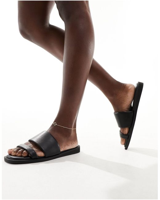 Sandalias negras minimalistas planas con diseño London Rebel de color Brown