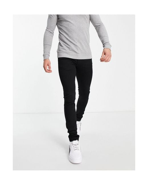 levi's 519 black extra skinny jeans