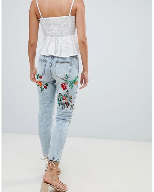 Women's floral embroidered best sale jeans
