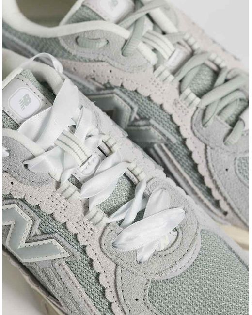 New Balance White 204L Scallop Trainers
