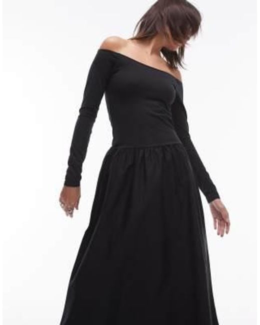 Robe mi-longue avec taille basse et encolure bardot Mango en coloris Black