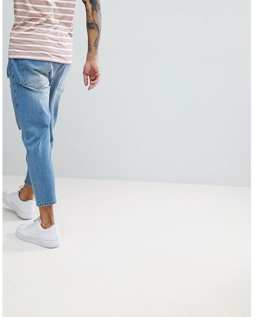 festspil storm Soaked Solid Tapered Cropped Jeans With Rips In Light Blue for Men | Lyst