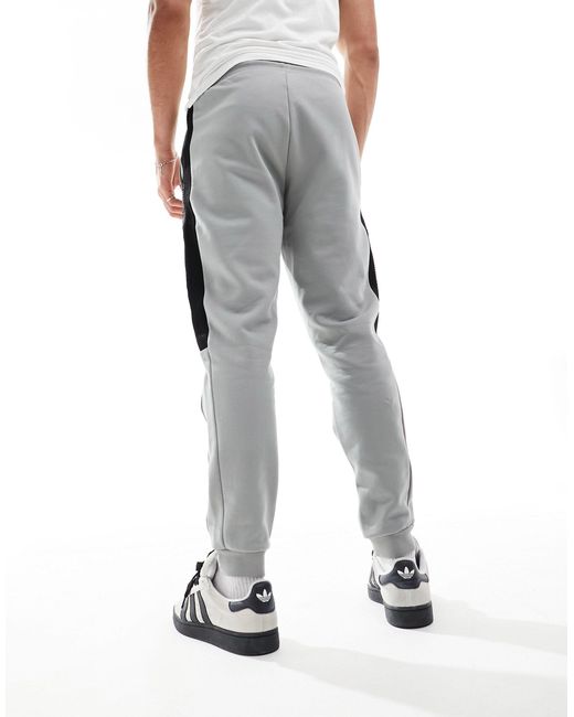 Armani - - joggers felpati grigi con logo, profili a contrasto e fondo elasticizzato di EA7 in White da Uomo