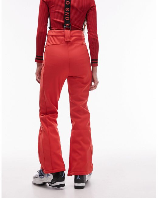 Sno - pantaloni da sci a zampa rossi con bretelle di TOPSHOP in Red
