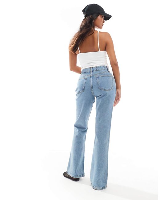 Asos design petite - jean évasé à taille mi-haute - clair ASOS en coloris Blue
