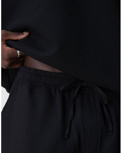 ASOS – schmal zulaufende plissee-jogginghose in Black für Herren