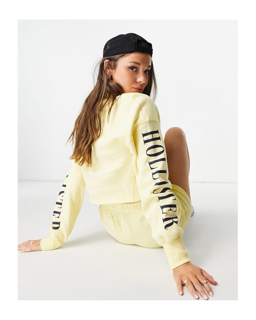 Sweat-shirt à logo sur les manches Hollister en coloris Jaune - Lyst