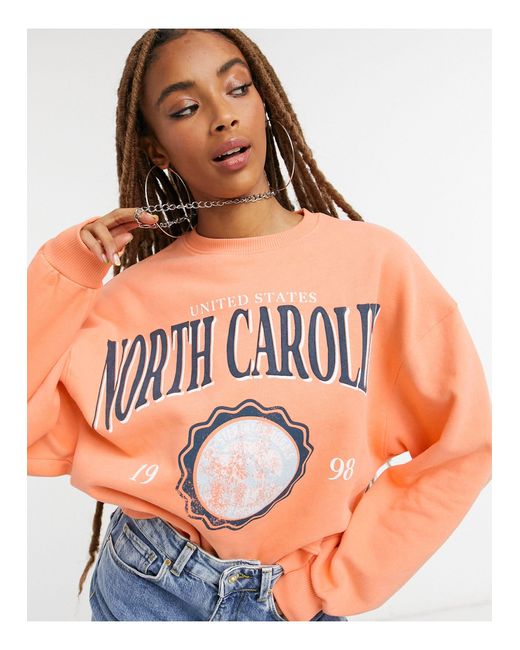 Bershka Oversized Sweater Met Universiteitslogo Van North Carolina in het  Oranje | Lyst NL