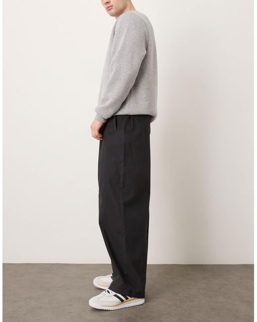 Pantalon oversize coupe baggy à pinces ASOS pour homme en coloris Black