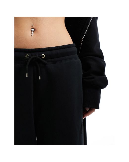 Nike Black – flight – fleece-jogginghose mit weitem schnitt