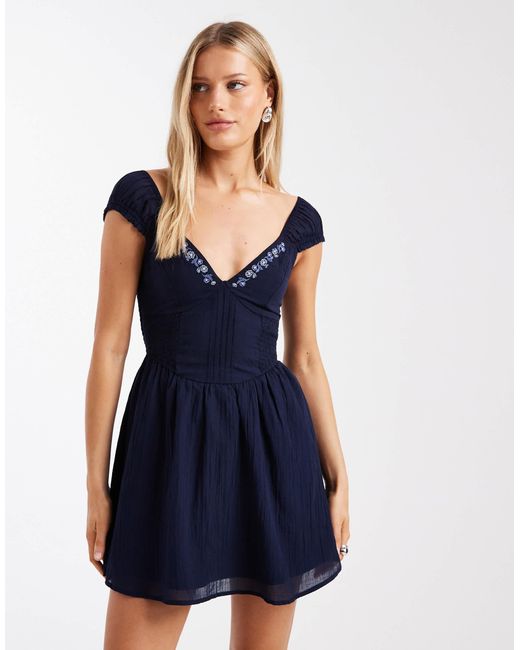 hollister navy blue dress Hollister halterneck maxi dress with tiered hem detail in navy paisley print