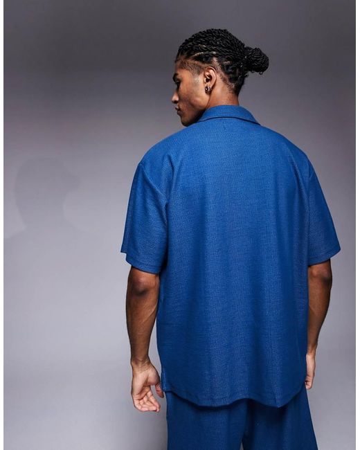 ADPT Blue Split Neck Texture Polo Shirt for men
