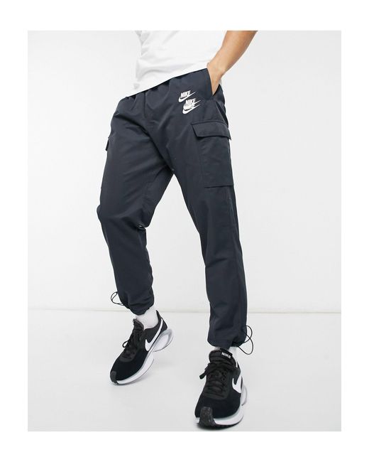 Nike World Tour Pack Graphic Woven Cuffed Cargo Trackies in Black for Men Lyst UK