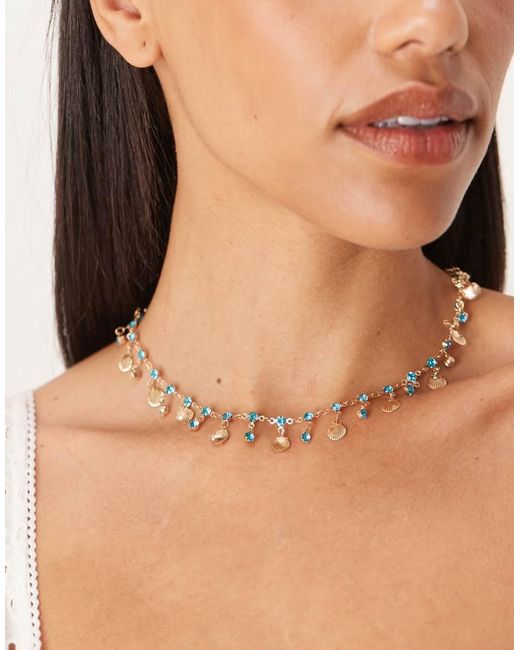ASOS Ketting Met Kleine Goudkleurige Schelpjes En Blauwe Siersteentjes in het Brown