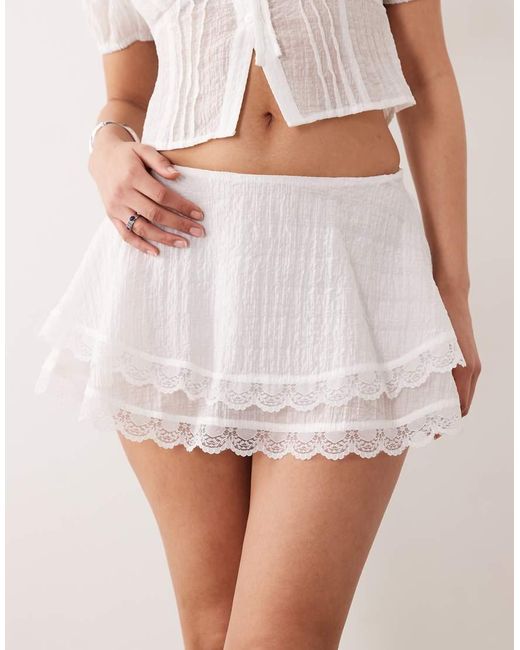 The Frolic White Exclusive Lace Trim Tiered Mini Frilly Skirt
