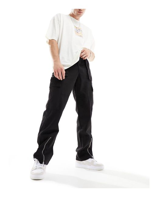 Pantaloni cargo a fondo ampio neri con spacco sul davanti e scritta del logo di Sean John in Black da Uomo