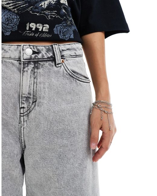 Paige - jupe culotte ample en jean à taille basse - délavé Monki en coloris Gray