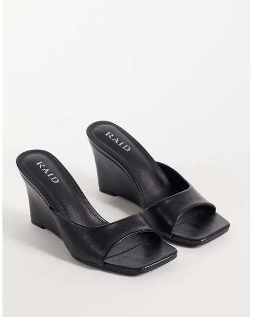 Raid Black Juniper mules mit keilabsatz