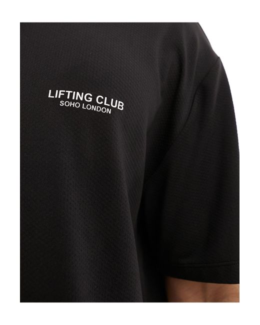 Camiseta negra deportiva suelta con estampado gráfico en el pecho ASOS 4505 de hombre de color Black