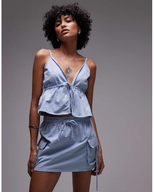 Top Con Lazada Delantera Y Volante Dolly De Rhythm de color Blue