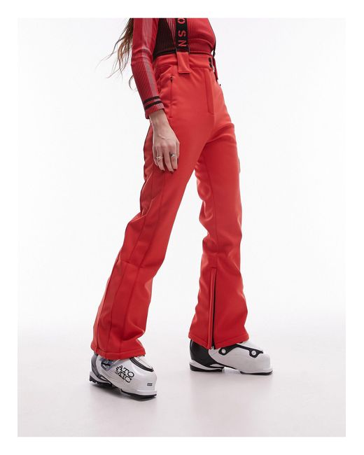 Sno - pantaloni da sci a zampa rossi con bretelle di TOPSHOP in Red