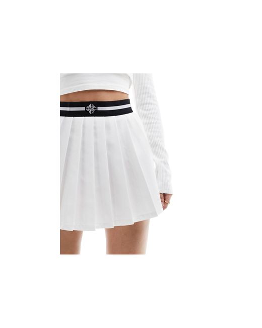The Couture Club White Emblem Pleated Tennis Mini Skirt