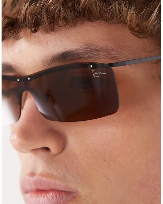 Karlkani – schmale sonnenbrille mit signatur und metallgestell in Brown für Herren