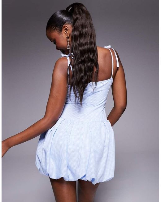 Vestido Corto A Cuadros Vichy Azules Con Tirantes Anudados Y Falda Abullonada Exclusivo De Kaiia de color White