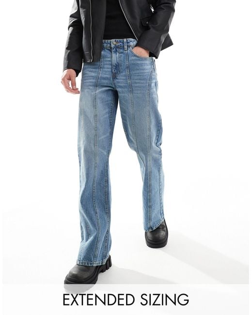Jeans ampi a zampa lavaggio medio con pannelli di ASOS in Blue da Uomo