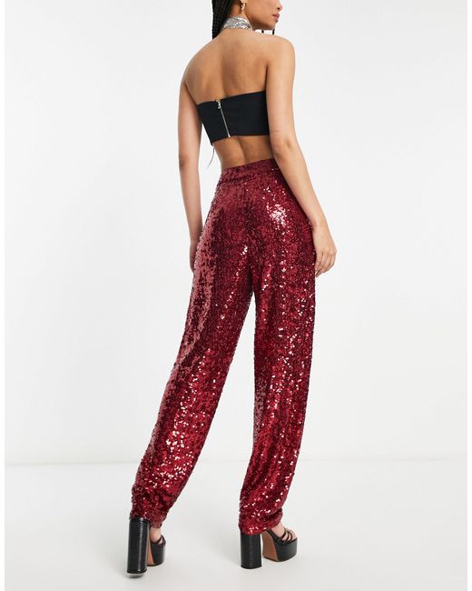 Asos design tall - pantaloni extra larghi rubino con paillettes di ASOS in Red
