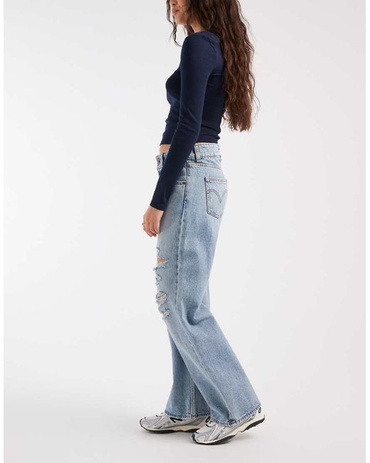 Levi's Blue Superlow Loose Jeans With Rips